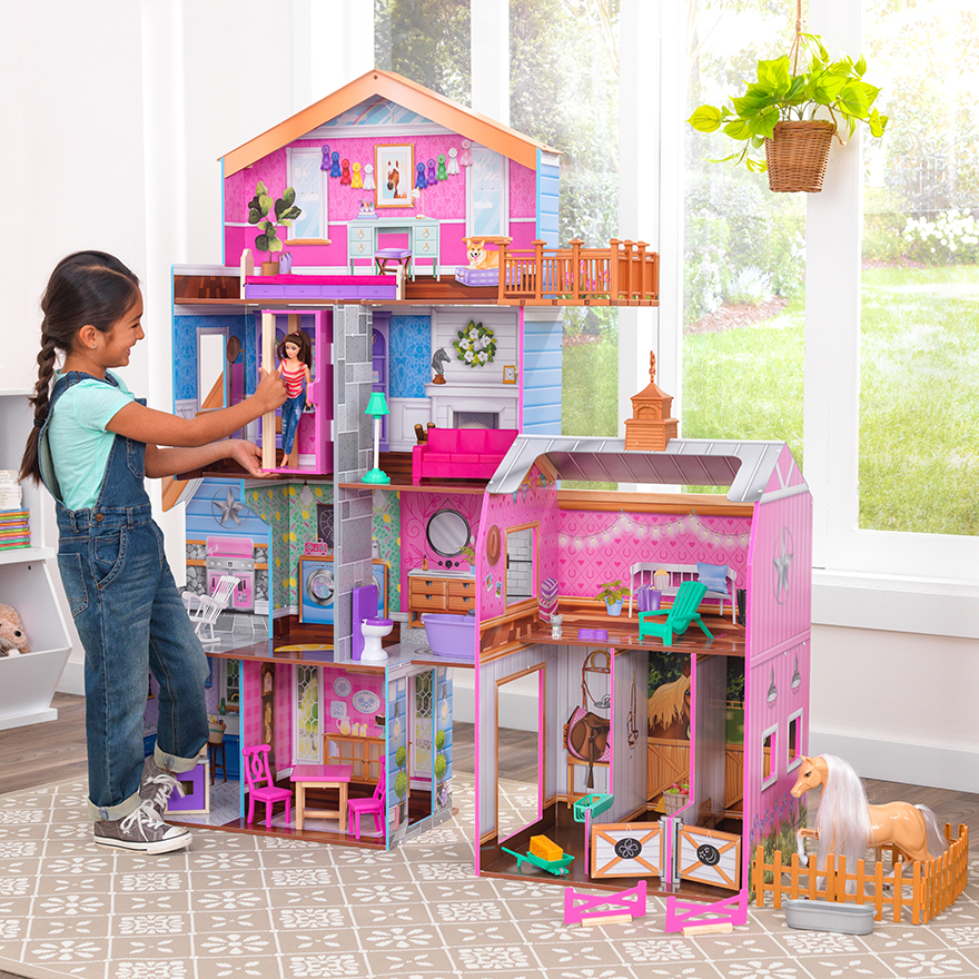 girl playing with KidKraft play kitchen